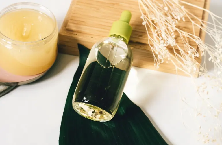 Skincare bottles and jars with botanical accents