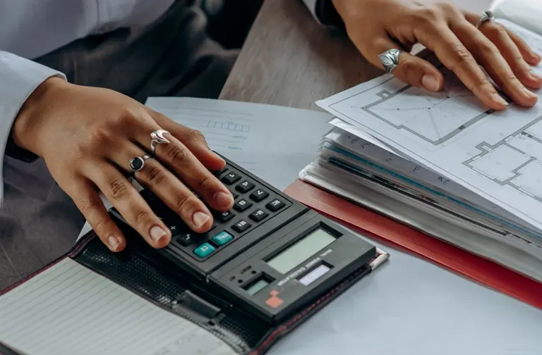 Calculator and documents on a desk