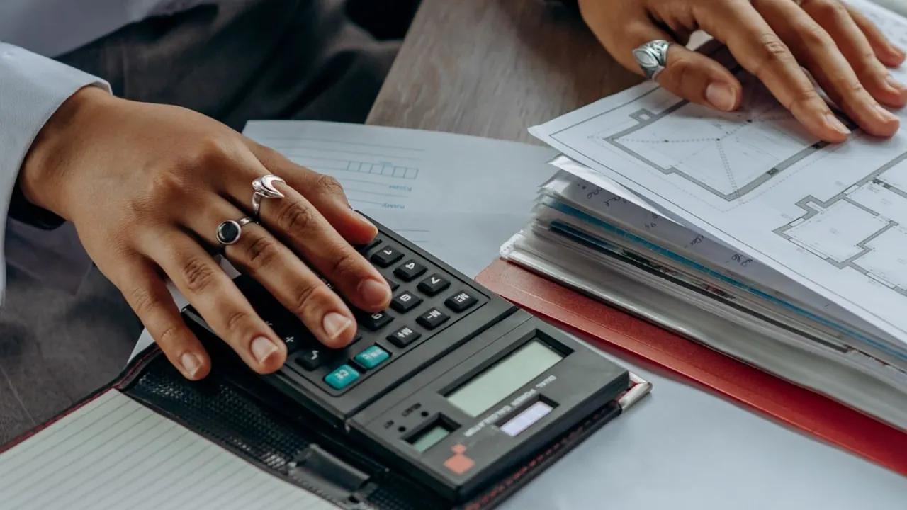 Calculator and documents on a desk
