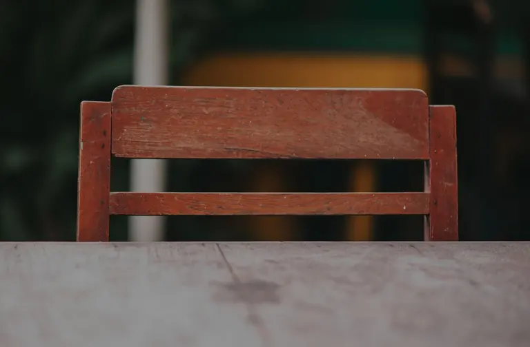 Wooden chair beside a wooden table