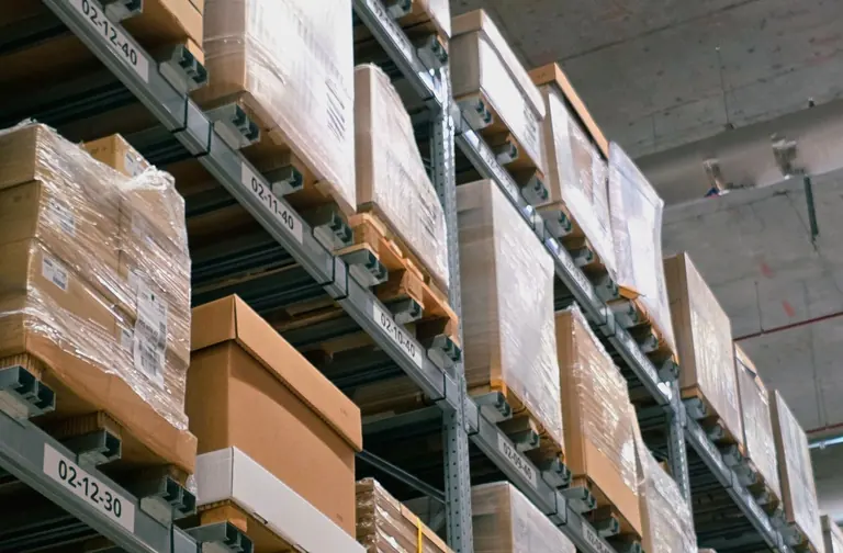 Cardboard boxes organized on warehouse shelving