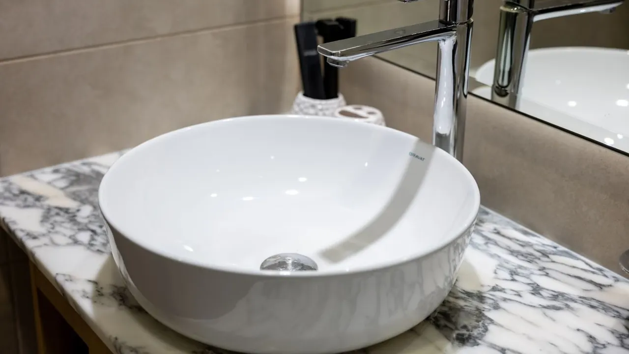 Bathroom basin with a chrome faucet