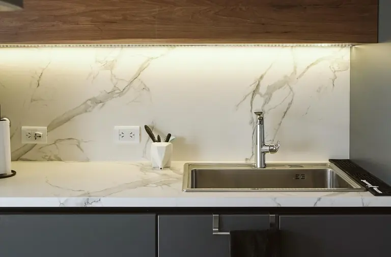 Marble kitchen countertop with a stainless steel sink